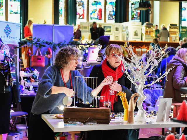 Browsing the large range of gifts availableat the Guildhall Christmas Fair. Photo: George Sweeney / Derry Journal