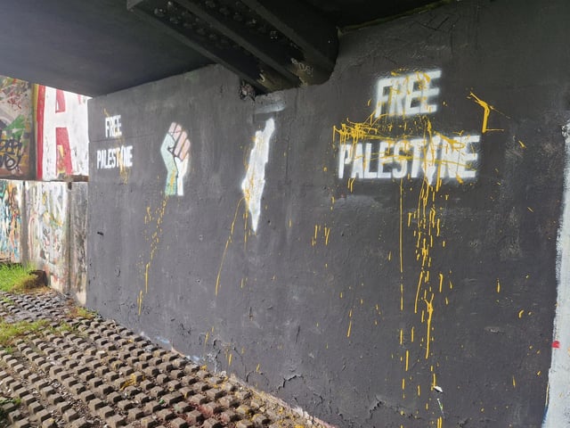 Yellow paint was spattered all over a pro-Palestinian mural overnight.