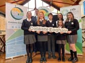 Coláiste Eoghain first years in their new uniforms with Principal and Deputy.