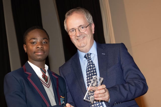 Mr. John Harkin, Principal, Oakgrove Integrated College, pictured presenting an award to Ishann.