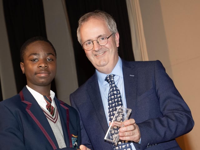 Mr. John Harkin, Principal, Oakgrove Integrated College, pictured presenting an award to Ishann.