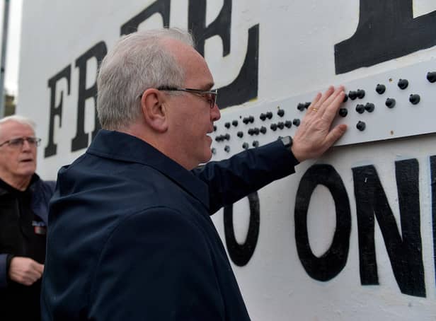 Richard Moore, from Children in Crossfire pictured at the unveiling of a Braille sign at Free Derry Corner on Tuesday afternoon Included in the photo is John Kelly, Museum of Free Derry. Photo: George Sweeney. DER2305GS – 62