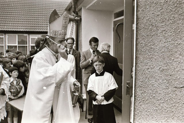Reverend Dr Edward Daly, Bishop of Derry, blessing the school during its official opening in 1975.