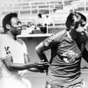Hilary Carlyle separating Pelé and Eusébio.