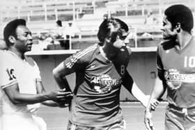 Hilary Carlyle separating Pelé and Eusébio.