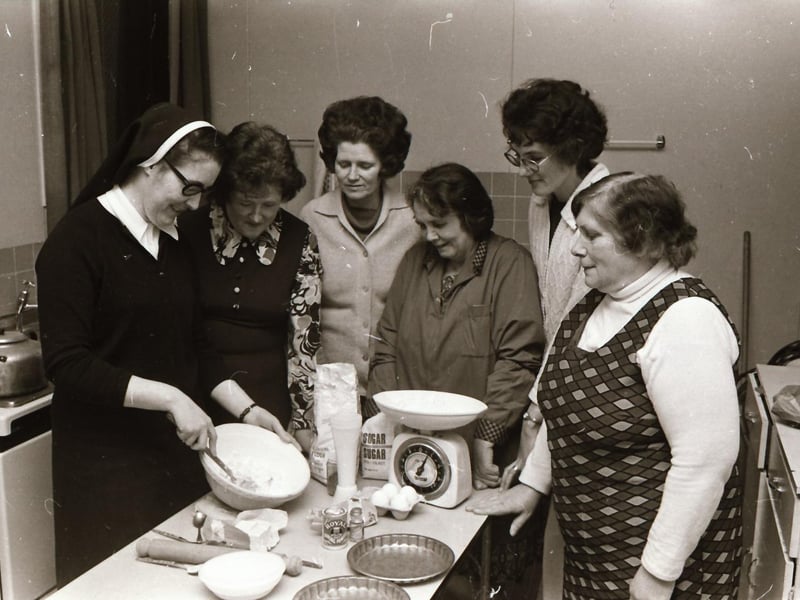 Tutor Sister Ethna leading cookery classes at Shantallow Women's Club.
