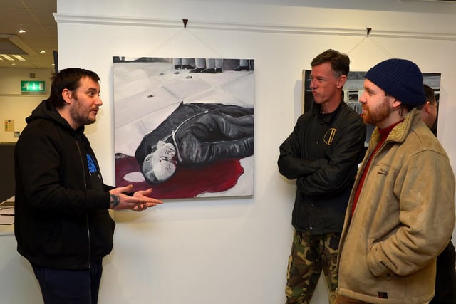 Artist Square Bear pictured with Donal O’Doherty and Oisin McCool at the launch of his exhibition ‘Injustice’ at the Eden Arts Centre on Monday evening last. The exhibition commemorating the 51st anniversary of Bloody Sunday runs until 1st February next.  Photo: George Sweeney. DER2305GS – 71
