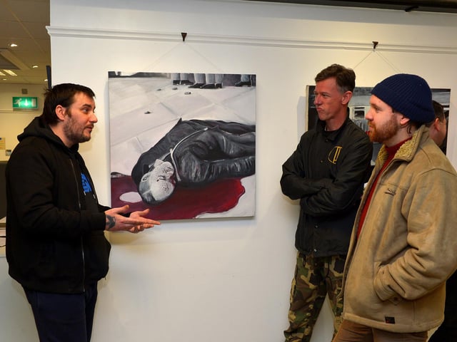 Artist Square Bear pictured with Donal O’Doherty and Oisin McCool at the launch of his exhibition ‘Injustice’ at the Eden Arts Centre on Monday evening last. The exhibition commemorating the 51st anniversary of Bloody Sunday runs until 1st February next.  Photo: George Sweeney. DER2305GS – 71