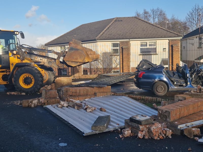 After the status red wind warning was lifted at 2pm work on clearing up the damage got underway in earnest with a JCB digger dispatched to the scene.