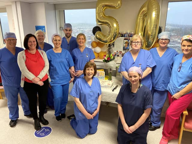 Marian McGrath, front row third from left (kneeling), with colleagues at Altnagelvin Hospital.