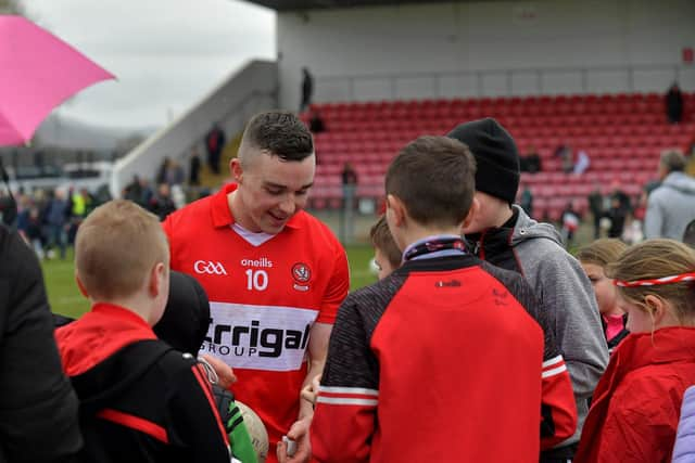 Niall Toner signs autographs after Derry’s victory over Clare at Owenbeg on Sunday afternoon. Photo: George Sweeney. DER2312GS - 16