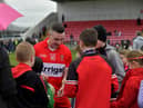 Niall Toner signs autographs after Derry’s victory over Clare at Owenbeg on Sunday afternoon. Photo: George Sweeney. DER2312GS - 16
