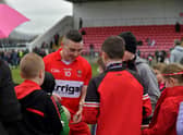 Niall Toner signs autographs after Derry’s victory over Clare at Owenbeg on Sunday afternoon. Photo: George Sweeney. DER2312GS - 16