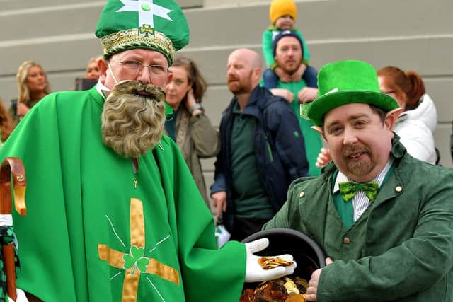 St Patrick and leprechaun with a crock of gold at Derry‘s St Patrick’s Day parade last year. Photo: George Sweeney. DER2311GS – 56