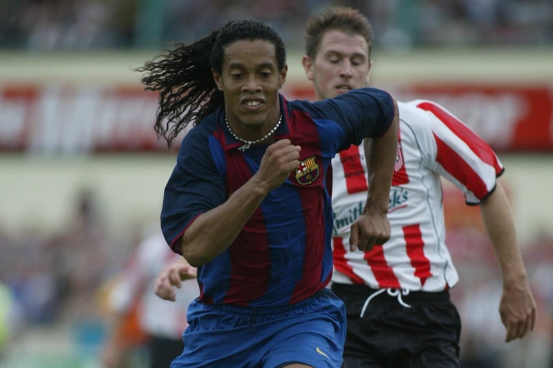Ronaldinho leaves Mark mcCrystal in his wake as he races forward to score his side's fifth goal.