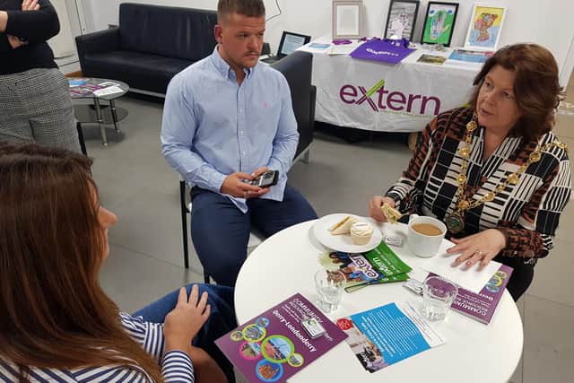 Mayor of Derry & Strabane Colr Patricia Logue meets staff from Extern at the launch of the charity's new mental health crisis cafe and community services directory.