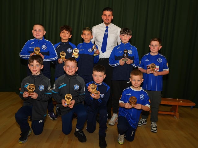 Vice-chairperson Diolain Ward pictured with Over 12 years old players who received 'Man of The Match' awards at the Trojans FC annual Youth Presentation held in St Cecilia’s College. Photo: George Sweeney