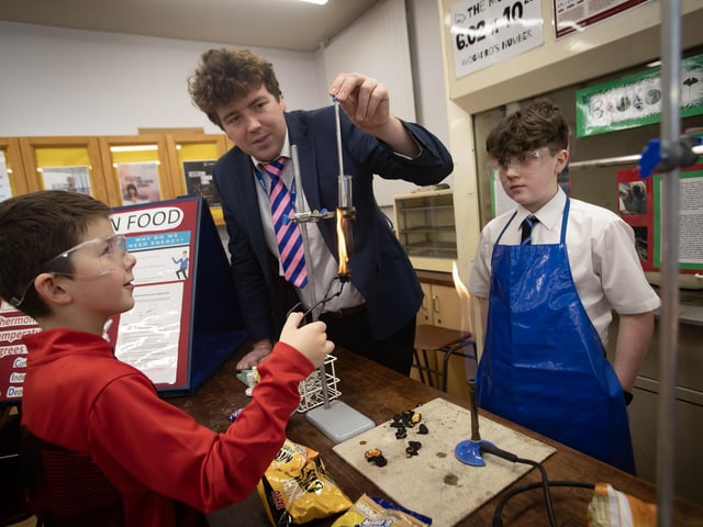 Science teacher Mr. Ennis showing some experimenting with fire during Saturday's Open Day. : .