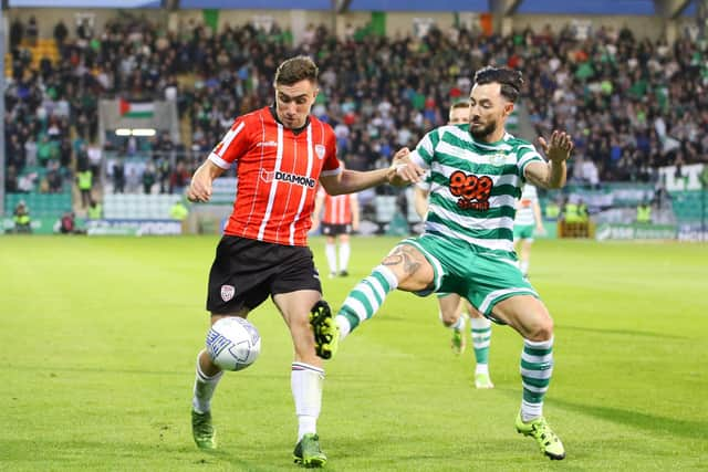 Derry City's Joe Thomson tussles with Shamrock Rovers midfielder Richie Towell during their encounter at Tallaght Stadium, in May.