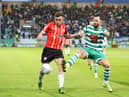 Derry City's Joe Thomson tussles with Shamrock Rovers midfielder Richie Towell during their encounter at Tallaght Stadium, in May.