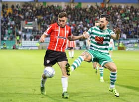 Derry City's Joe Thomson tussles with Shamrock Rovers midfielder Richie Towell during their encounter at Tallaght Stadium, in May.