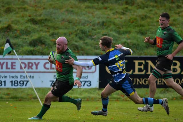 David Graham of City of Derry crosses the white wash to score his first try against Dromore. Photo: George Sweeney