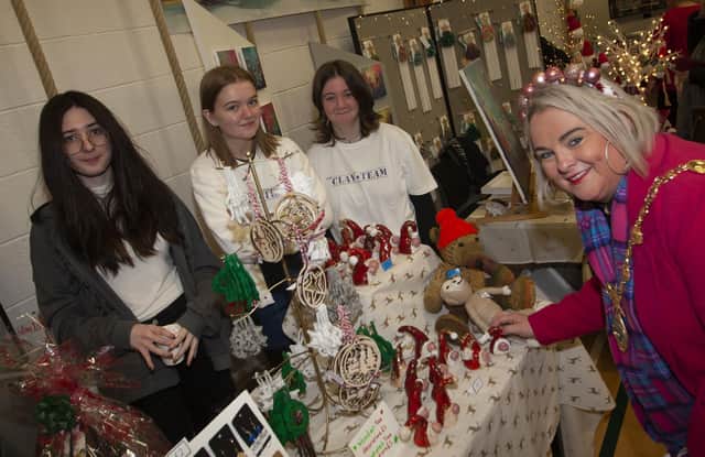St. Mary’s students and stallholders Lilian, Rebecca and Madison pictured at their stall with the Mayor, Sandra Duffy.