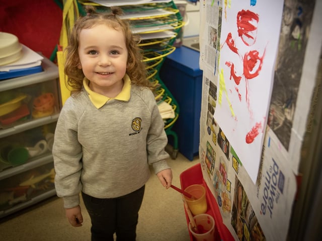 This young lady showing off her painting talents during Open Day at the Model PS. : .