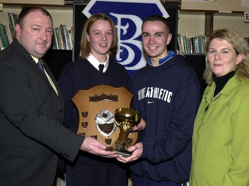 Councillor Philip Kelly, Board of Governors, presenting the Sportsgirl and Sportsboy of the Year Awards to Pauline Doherty and Simon. Included is Siobhan Heaney, Board of Governors. (1/12/CD14) : Pictured are students, staff and invited guests at the annual school prize-giving at St Brecan's High School, Top of the Hill back in the year 2000.