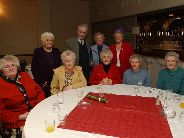 Seated from left, Gabrielle Lynch, Susan McGuinness, Mary Harkin, Margaret Harkin, and Bessie Gallagher. Standing, from left, Brigid McLaughlin, Paddy McLaughlin, Margery McLaughlin, and Agnes McLaughlin. (0912PG35) :Christmas parties for Derry's senior citizens in December 2003