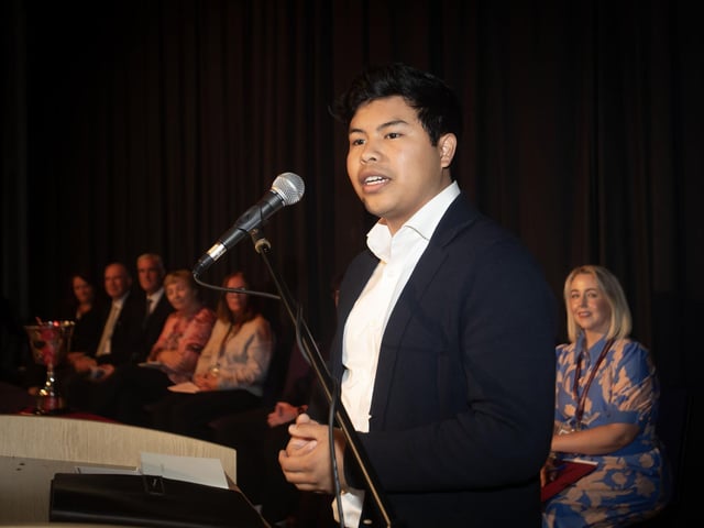 Mr Ramel Abdon Flores, Causeway Empowerment Programme and Past Pupil addressing the attendance at Oakgrove's Senior Prizegiving.