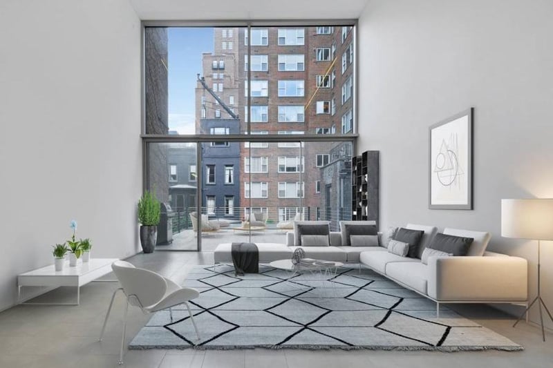 The living room features a 34-feet floor-to-ceiling window that leads to a 600 sq feet terrace.