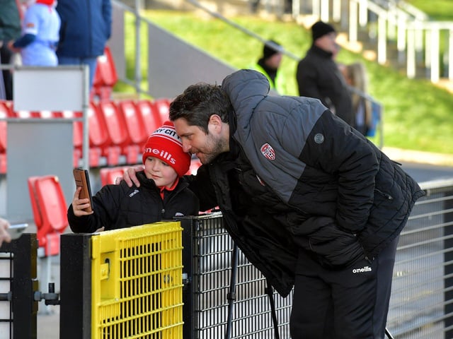 Derry City manager Ruaidhri Higgins makes time for a selfie with a young fan before the game against Bohemian on Monday evening. Photo: George Sweeney. DER2315GS – 107