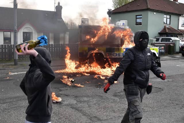 A Police vehicle is attacked with petrol bombs in the Creggan area on April 10, 2023 (Photo by Charles McQuillan/Getty Images)
