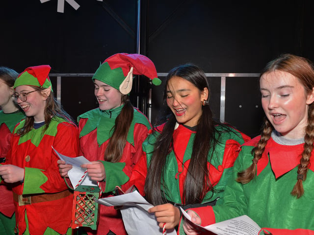 Pupils from Thornhill College sing Christmas carols at the Culmore Community Hub on Friday night. Photo: George Sweeney