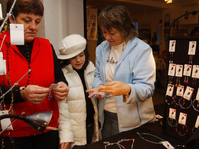 Looking over hand made jewellry at the Leztec Collection stall are, from left, Kathleen Doherty, Kerry Doherty, and Kathleen MCGonagle. (0612PG51) : Christmas in Inishowen in 2005.