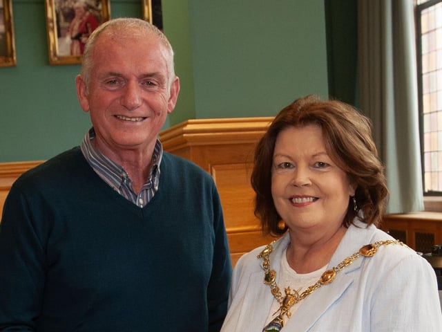 Retiring driver Vinny Trevor Tracey receiving his award from the Mayor, Patricia Logue.