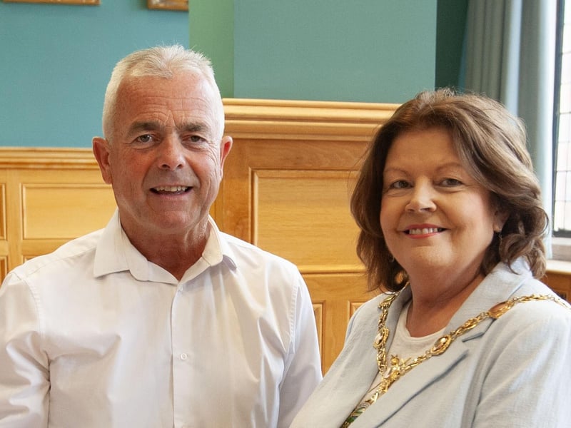 Retiring driver Vinny Morrison receiving his award from the Mayor, Patricia Logue.