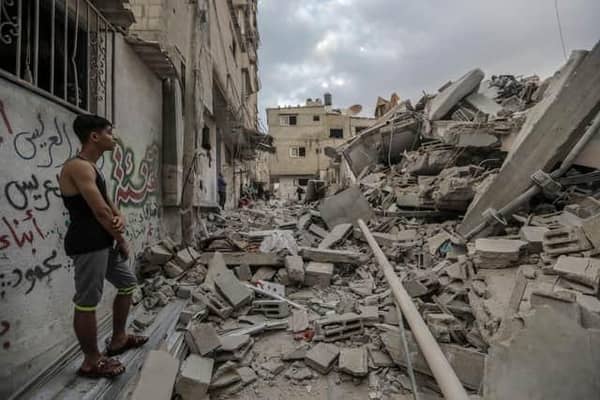 People search through buildings, destroyed during Israeli air strikes a day earlier, in the southern Gaza Strip on November 14, 2023 in Khan Yunis, Gaza. (Photo by Ahmad Hasaballah/Getty Images)