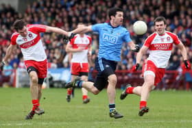 Dublin's Michael Dara Macauley tries to break past Derry duo Benny Heron and Mark Lynch in Celtic Park back in 2014. (Photo Lorcan Doherty / Presseye.com)