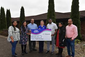 Foyle Hospice Staff Nurse Deirbhile Logue receives a donation of £4204 from members of the Kerala Association. From left are Devika Sudheesh, Dr Simi Rajeev, Matthew Thomas, Thomas Robin George, Jesty Simon and Baiju Narayanan. Photo: George Sweeney
