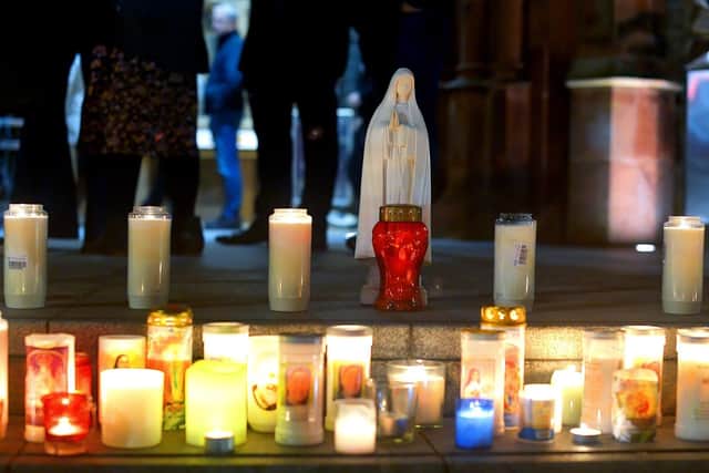 Candles placed on the steps of the Guildhall beside a statue of the Blessed Virgin Mary at a vigil held on Monday evening to remember those who died in the Creeslough tragedy on Friday afternoon last. Photo: George Sweeney. DER2241GS – 60
