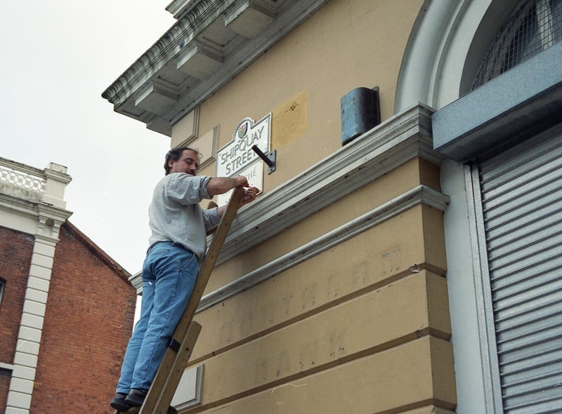 One of the first street signs in Irish being erected at Bishop Street Within in 1992.