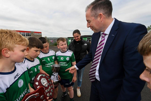 Education Minister Paul Givan is meets members of the gaelic football team during his visit to the  Naíscoil Dhoire and Bunscoil Cholmcille, Steelstown, on Wednesday morning. Photo: George Sweeney
