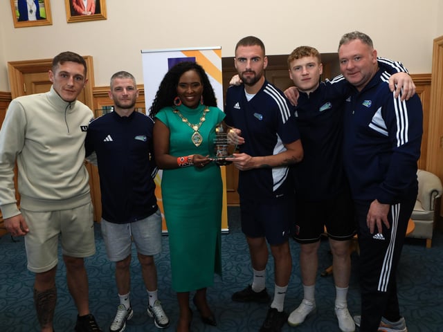 Mayor Lilian Barr making a presentation to the Street Soccer NI team captain, Ryan Sharkey, winners of the Irish Street Soccer League held in Dublin. From left are Michael Devlin, Caoimhinn Gallagher, and from right Adrian Curry, co-ordinator Street Soccer NI, and Eoghan Dobbins. (Photo - Tom Heaney, nwpresspics)