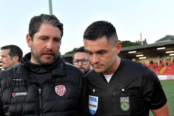Derry City manager Ruaiddhri Higgins speaks with referee Rob Hennessy after the final whistle. DER2321GS - 