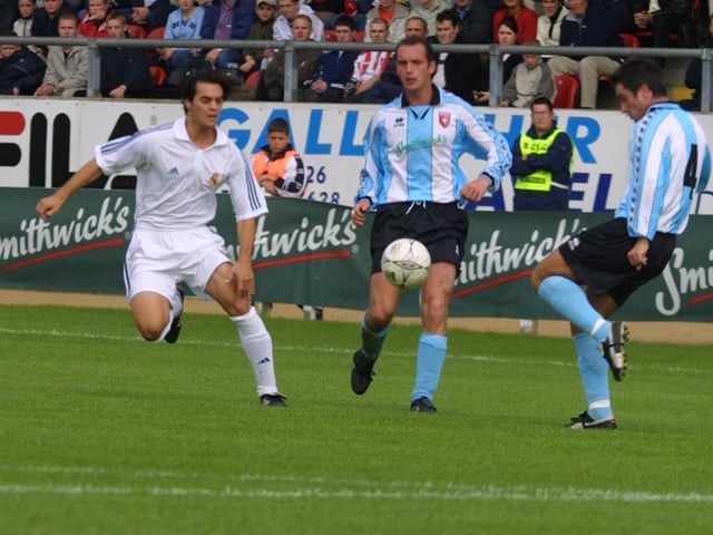 Darren Kelly clears the ball while Madrid midfielder Manu and Derry's Paddy McLaughlin challenge.(2208JB77)