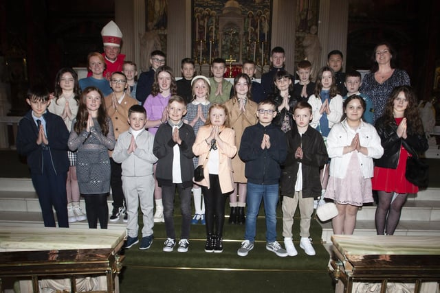 Pupils from Nazareth House PS who received the Sacrament of Confirmation from Rev. Dr. Donal McKeown at St. Columba’s Church, Long Tower on Thursday evening last. Included is Mrs. Roisin Blackery, Principal and Mrs. Joanna Higgins, teacher. (Photo: Jim McCafferty Photography)