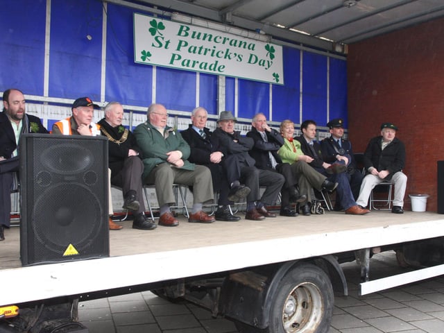 Dignitaries on stage await the arrival of the floats during Buncrana's St. Patrick's Day parade on Sunday. 1903JM25