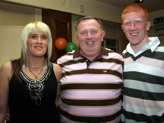 Donal pictured with Godchildren Michaela and Eugene at the Beectree Bar, missing from the photograph are, Arldline, Sharon and Dessie 0214JML : Parties and celebrations across Derry in May 2006.